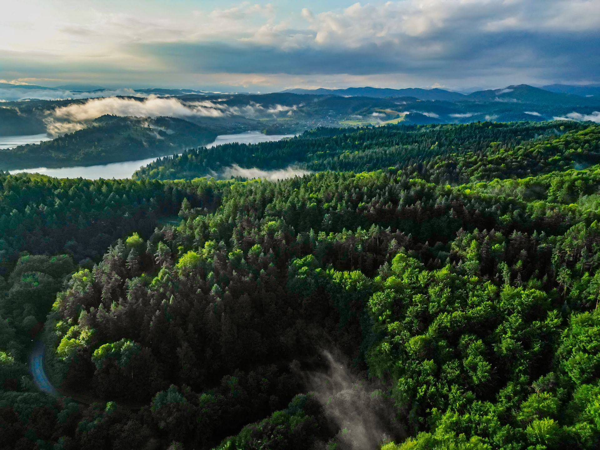 Morning mist over valley and lake